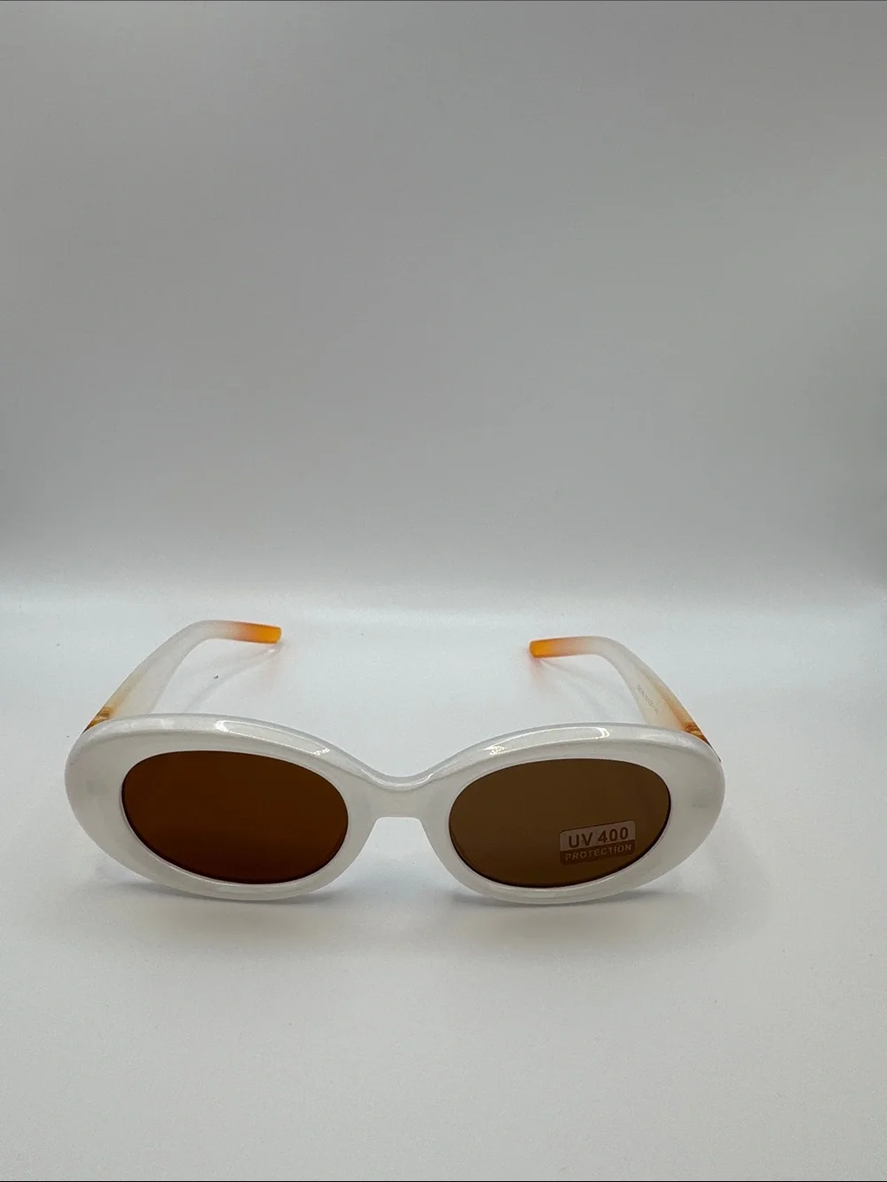 White Oval Sunglasses with Brown Lenses